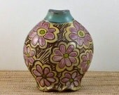 Vase turquoise and yellow with pink flowers