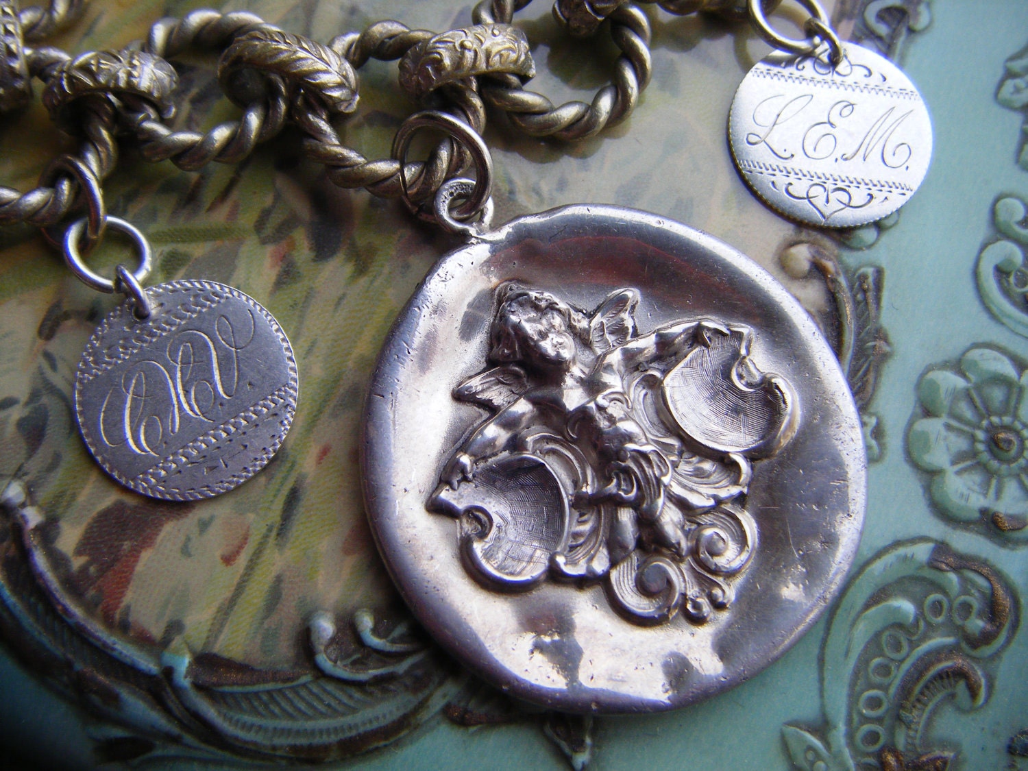 Victorian repousse charm bracelet bookchain sterling silver cherub love token link antique assemblage