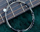 Recycled Guitar String Bangle with Black Glass Beads Gift for Musician or Music Lover
