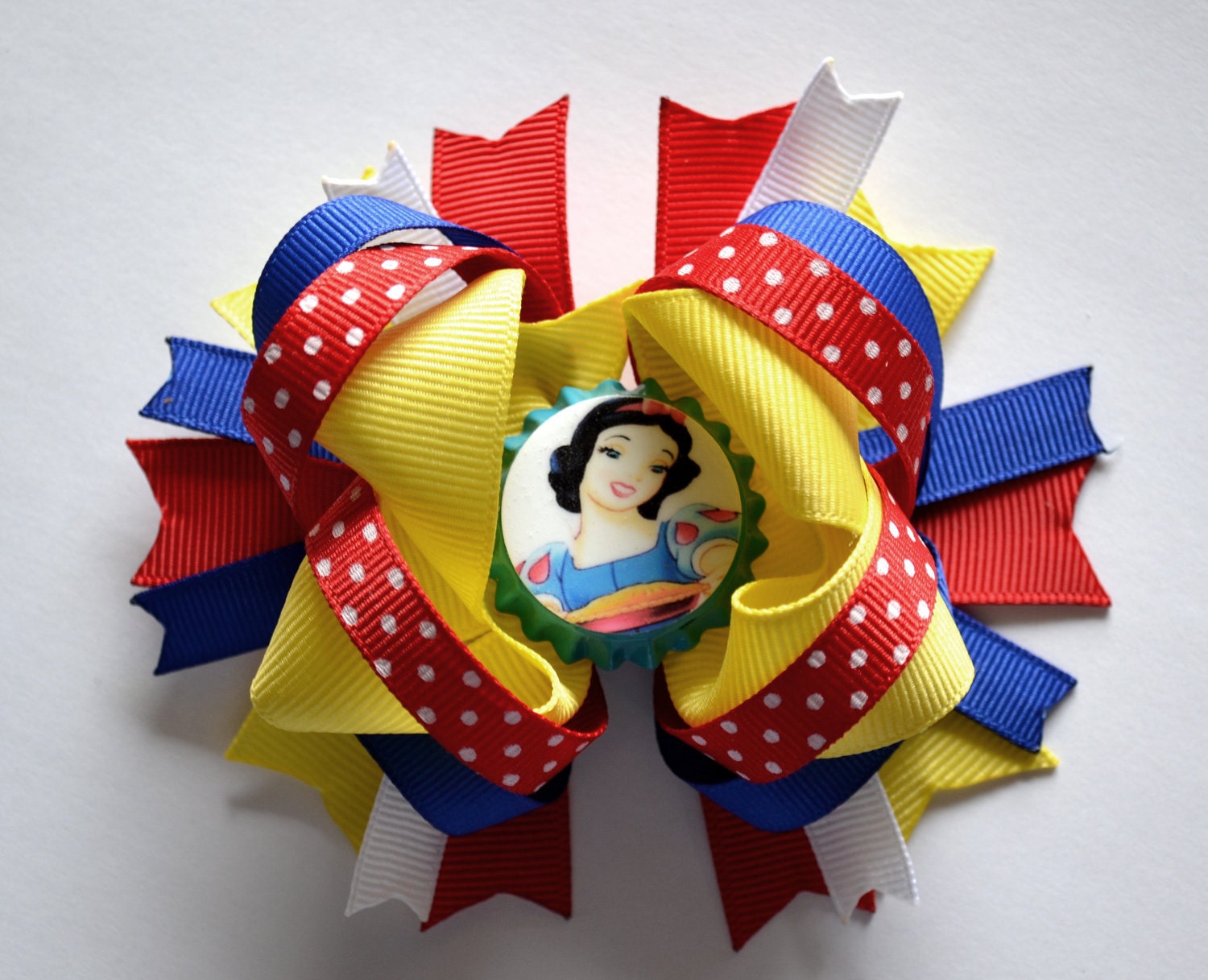 Adorable Princess Snow White bottlecap hair bow. Disney inspired hair bow.