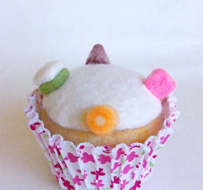 Cupcake with white icing and dolly mixtures
