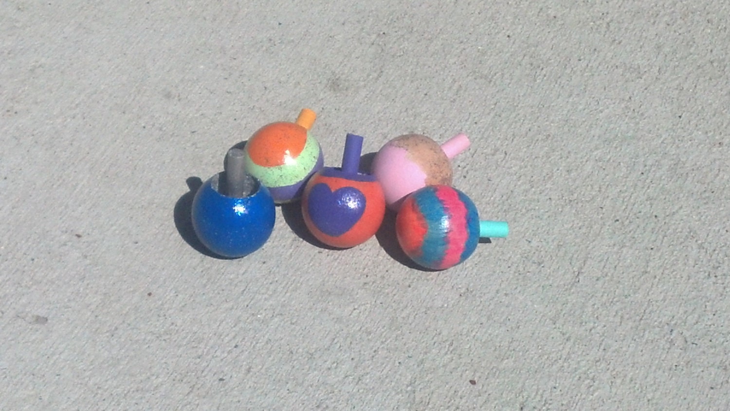 Handpainted wooden tops.. game on..
