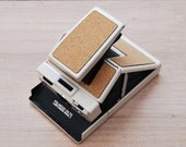 Polaroid SX-70 white with Cork skin - wtrphl Polaroid SX-70 white with Cork skin - wtrphl