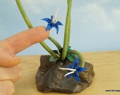 Origami Ikebana with Tiny Blue Flowers and Tall Grass