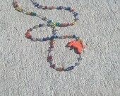 Toucan Bird Pendant Transparent Rainbow Beads on Denim Waxed Linen