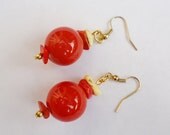 Round orange ceramic bead with semi precious orange and light yellow dyed howlite chips