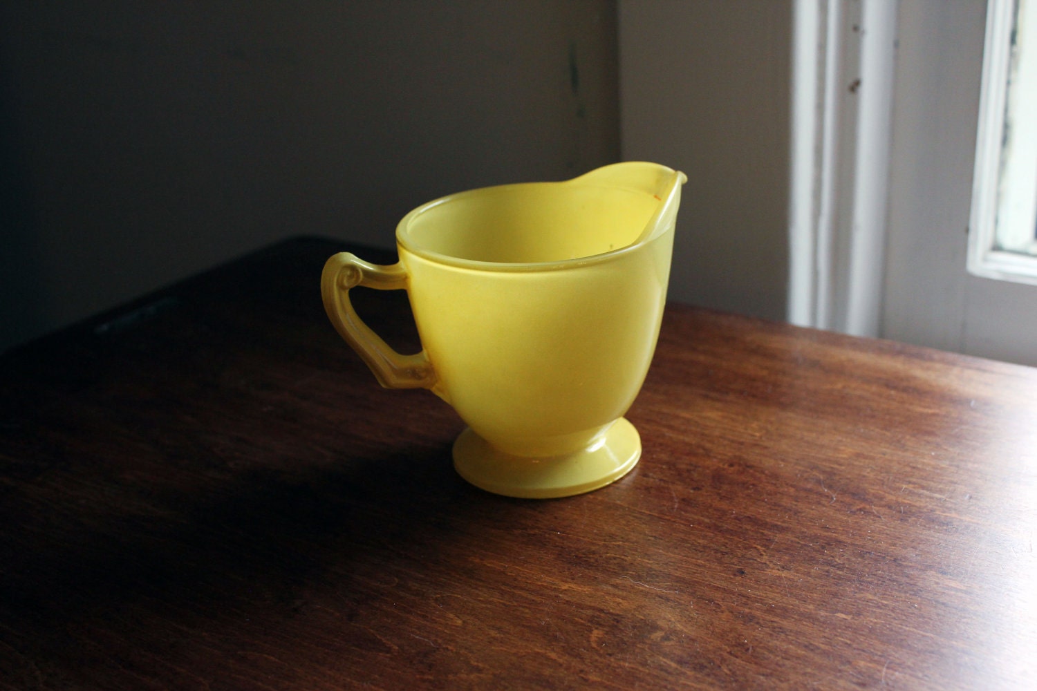 Yellow glass creamer