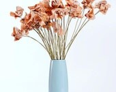a dozen old romance novel paper flowers