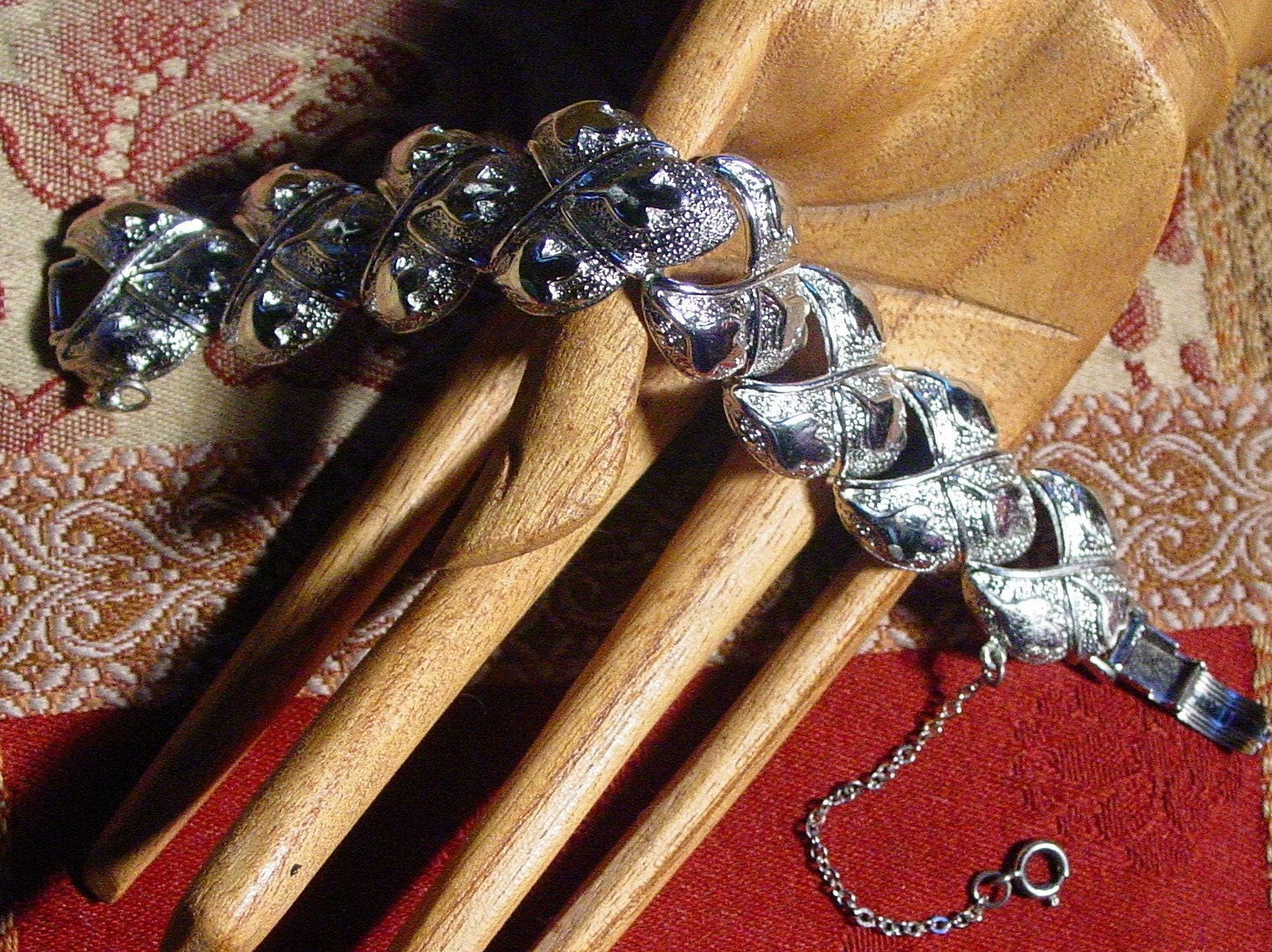 Silver CORO Pegasus U. S. patent pending link bracelet with fold over clasp and safety chain