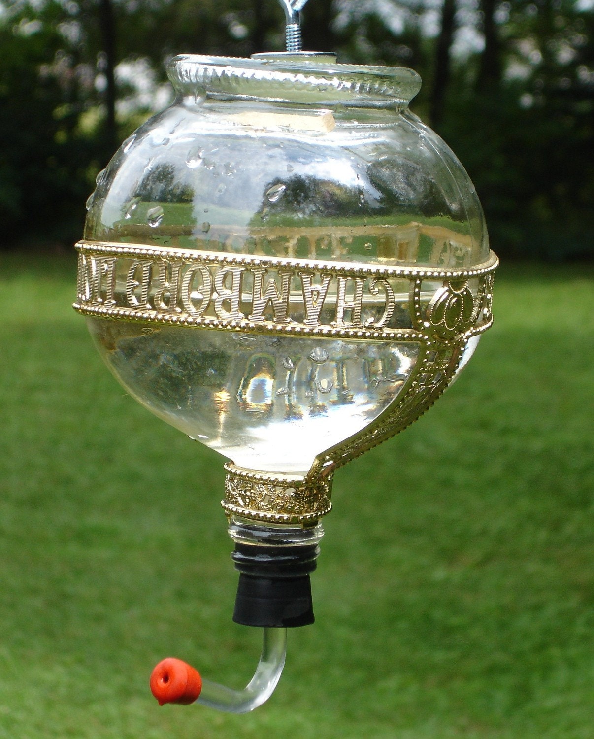 Hummingbird feeder from Recycled Chambord Bottle