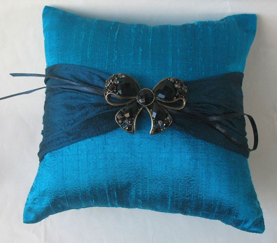This lovely romantic jeweled wedding ring pillow is made with a dark teal 