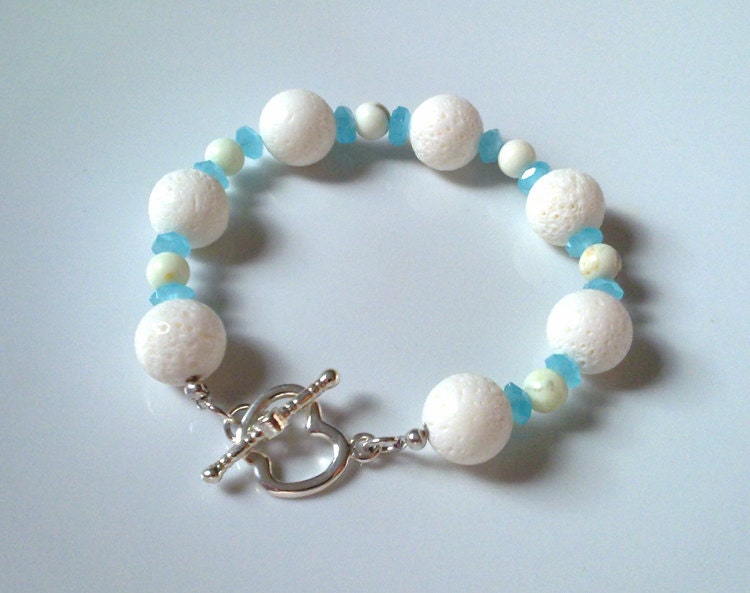 Handmade, delicate bracelet with white corals, lime stone and apple shaped clasp