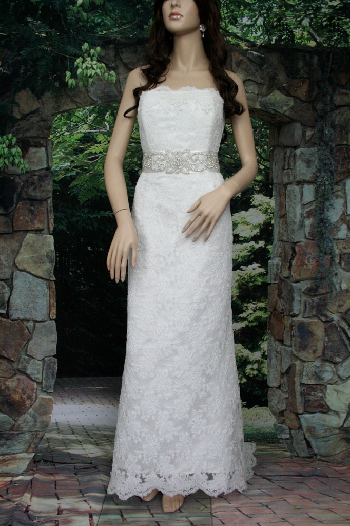Ivory strapless alencon lace wedding dress with rhinestone sash