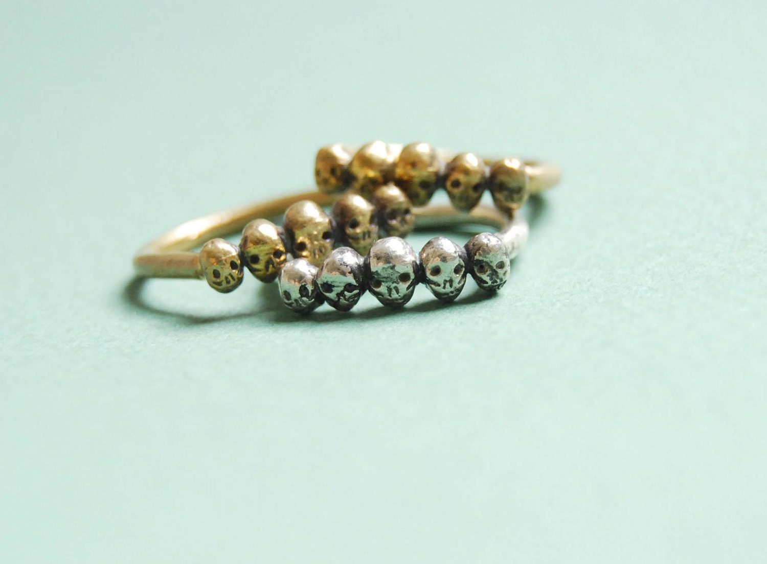 Row of tiny skulls sterling silver ring