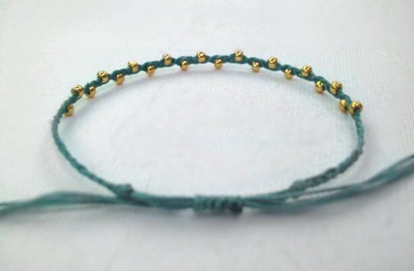 riley. dainty layering friendship bracelet gold beads on adjustable cotton cord