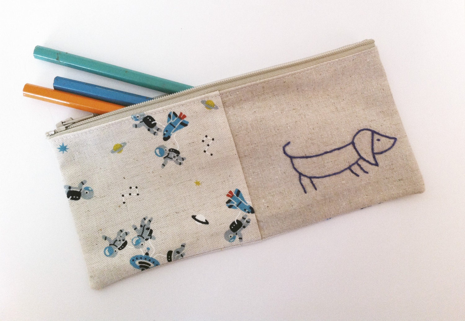 Sausage dog pencil case or zipper pouch. hand embroidery in blue with rockets linen cotton blend fabric