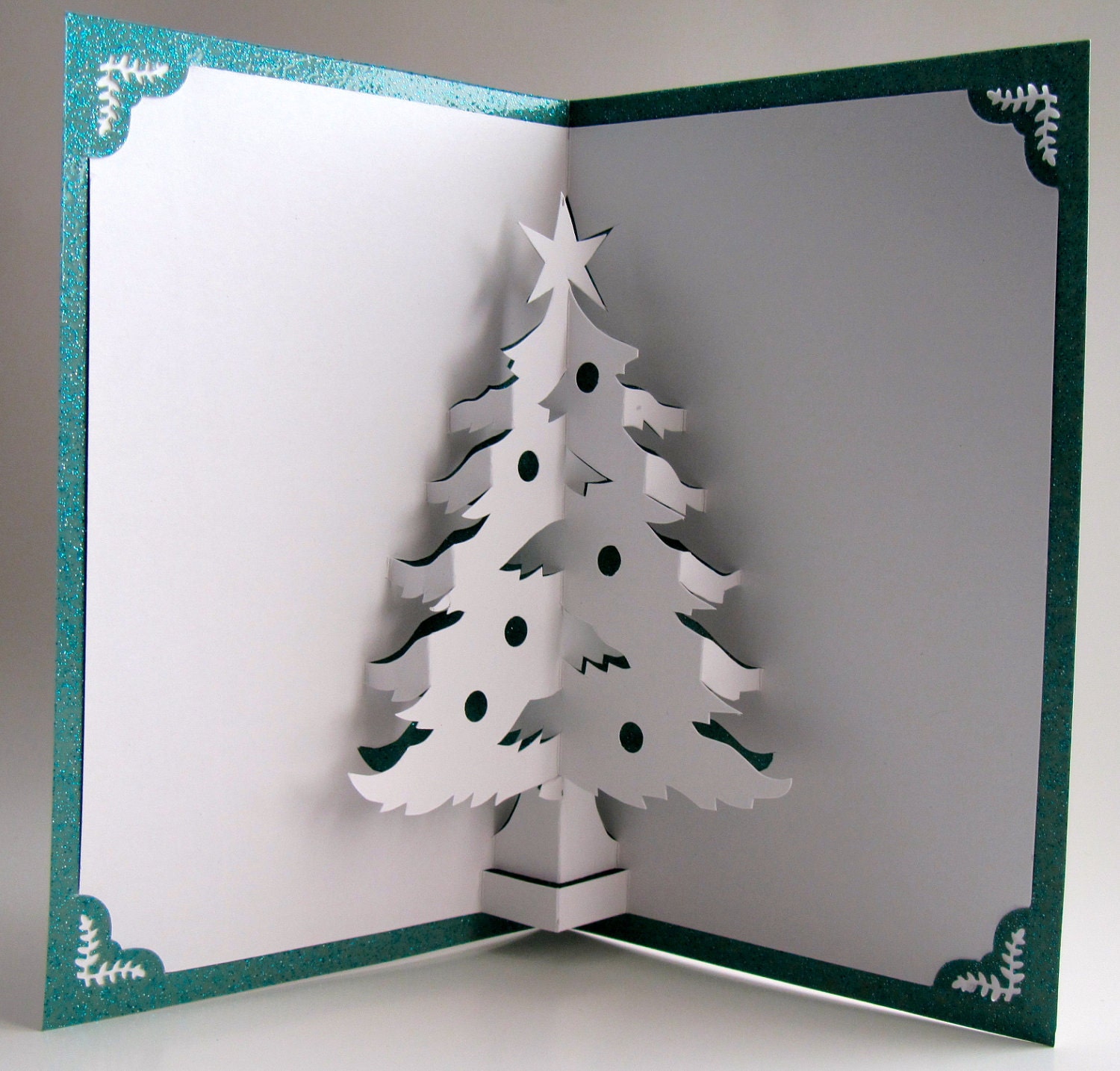 Christmas Tree Pop Up Home Décor 3D Handmade Cut by Hand Origamic Architecture in White and Shimmery Metallic Teal Green.