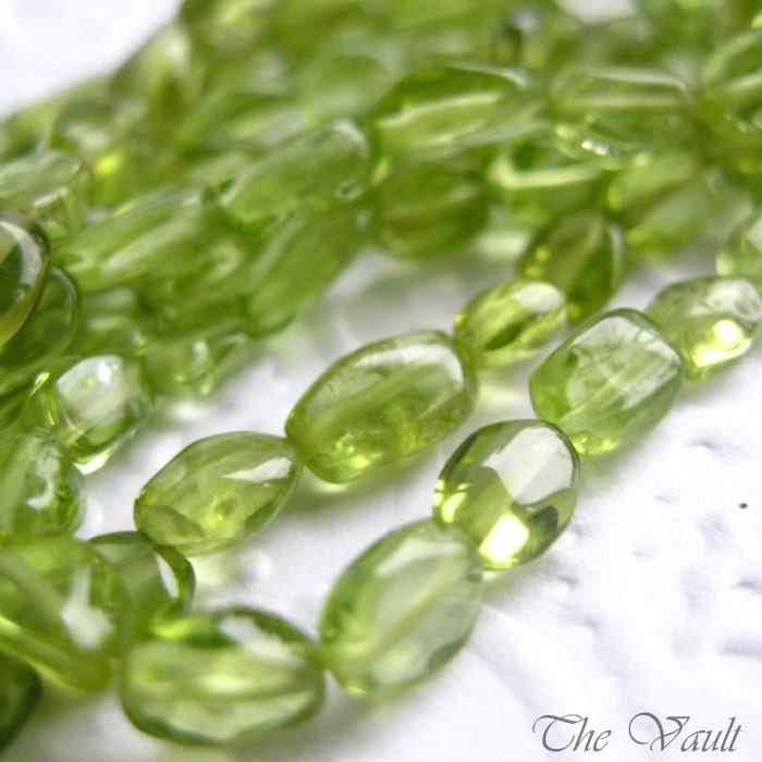 Peridot smooth oval beads, irregular 5-8mm, 14 inch strand