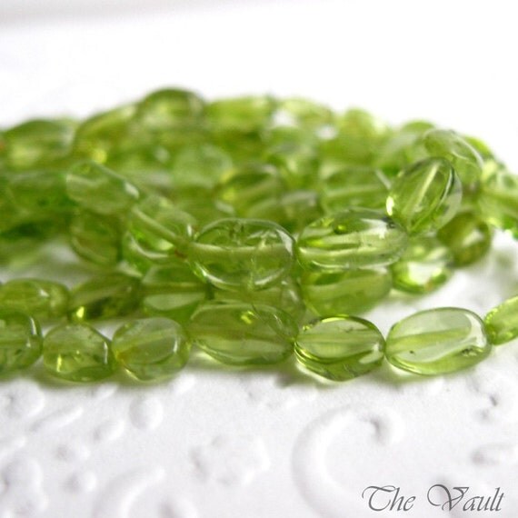 Peridot smooth oval beads, irregular 5-8mm, 14 inch strand