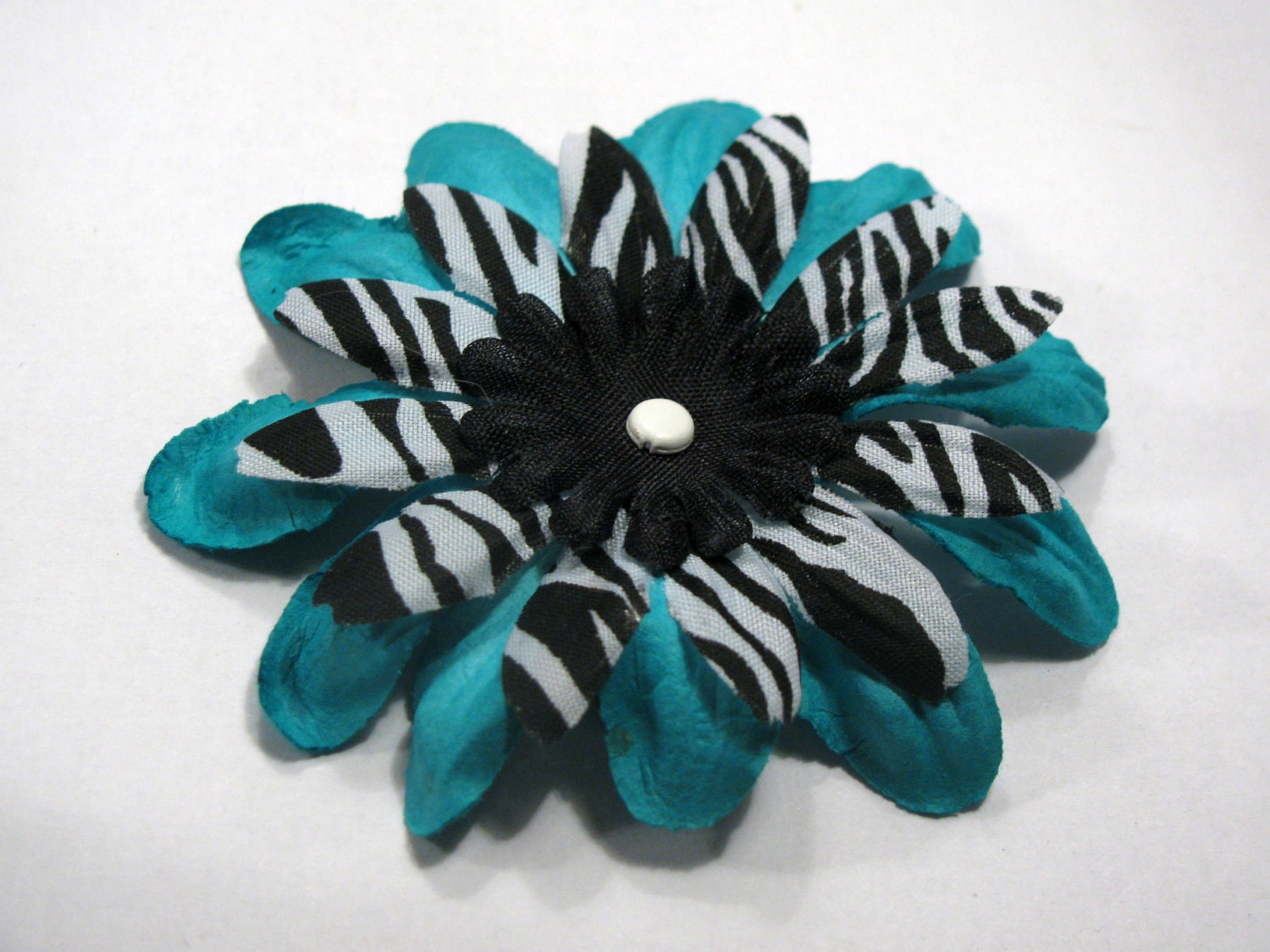 Turquoise and black zebra hair flower clip by VivaVegaBoutique from etsy.com