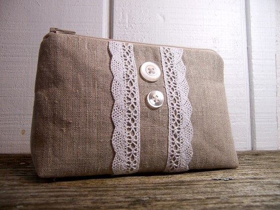 Cosmetic bag in rustic linen with white lace.
