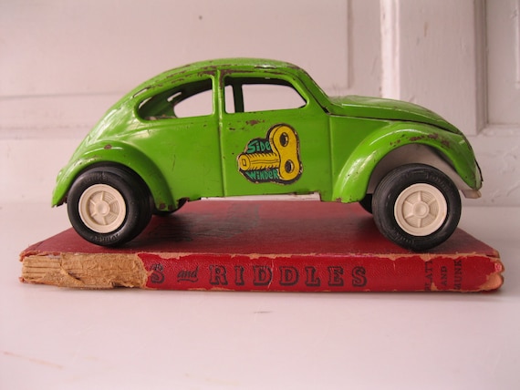 Lime green vintage VW bug toy car