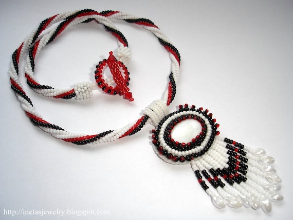 Necklace with bead embroidery cabochon.