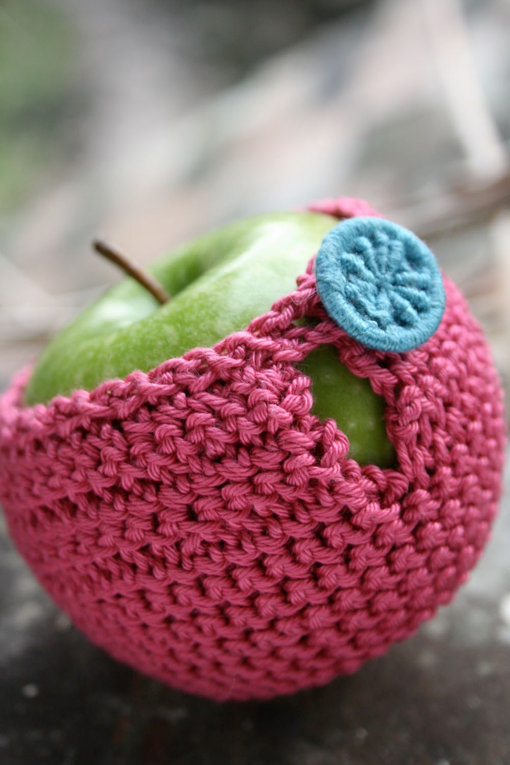 Apple cozy crocheted in pure cotton yarn with a Dorset button
