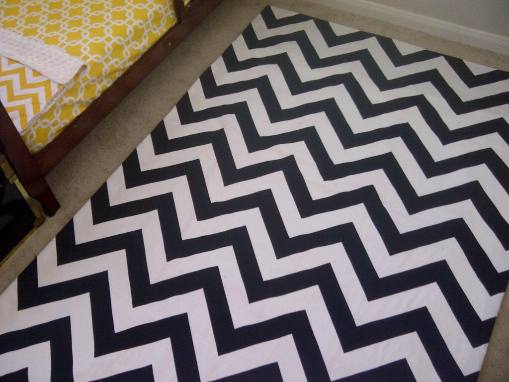 Woven area rug in a Modern and Classy black and white Chevron stripe in 4 ft by 6ft