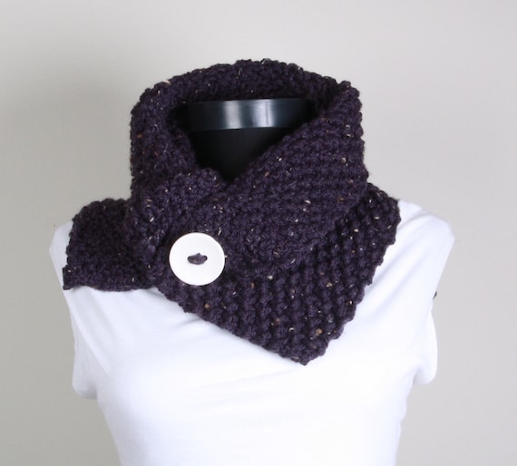 Purple knitted neckwarmer with big white button