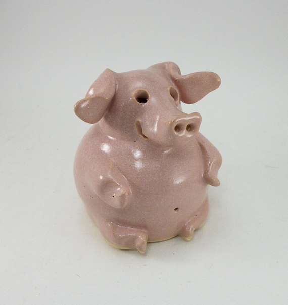 small sitting piggy bank