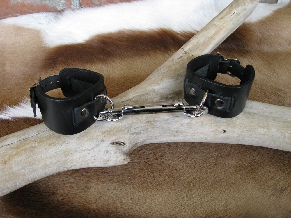 Ebony Bondage Cuffs One row From OublietteLeather