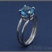 Floating blue Topaz sterling silver ring