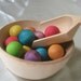 Natural Wood Toy - Montessori Sensory Game  - Wooden Rainbow Balls, Scoop and 2 Bowls Set for Transferring with Tin Storage Box