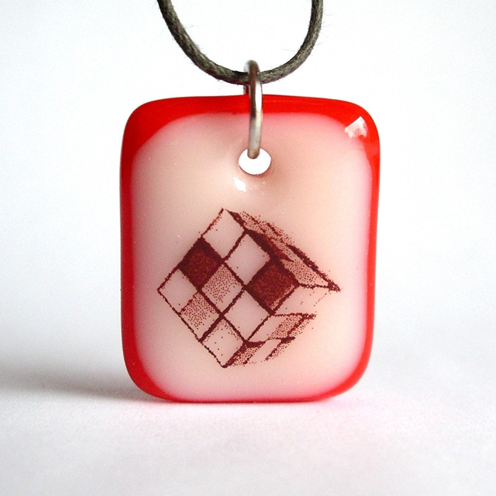 Rubik's Cube on Vanilla and Red. A fused glass pendant necklace.