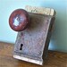 Vintage skeleton key lock set with two knobs one black, one brown