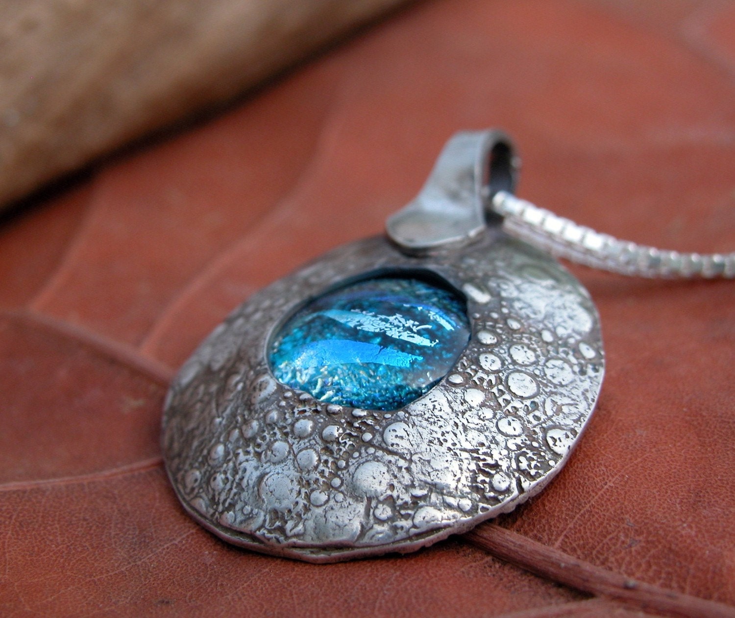 fine silver sea urchin pendant with dichroic glass