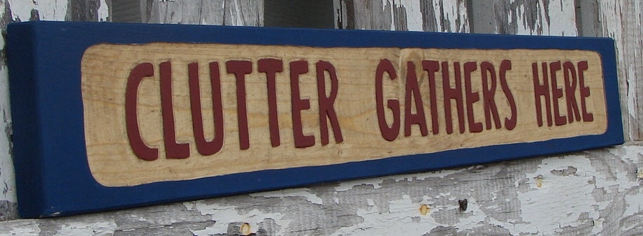 Clutter Gathers Here sign