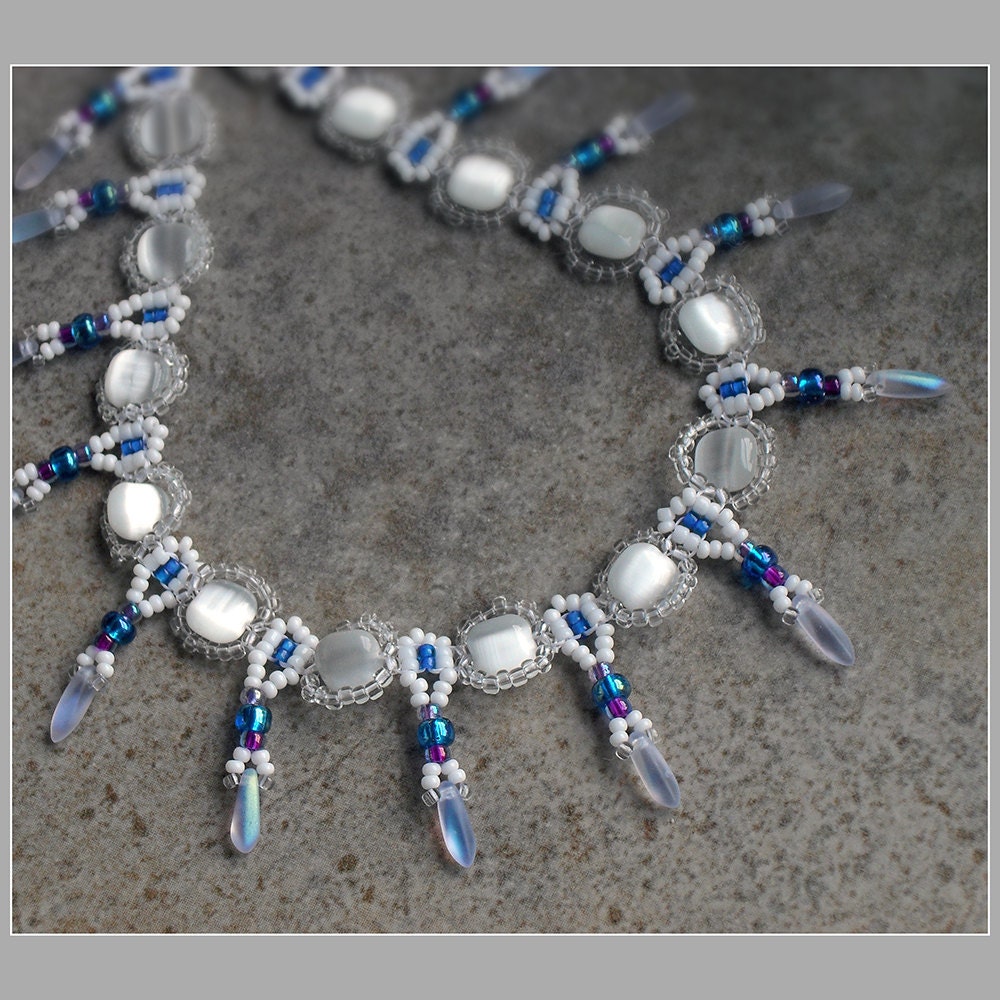 Elegant White Necklace - Cat's Eye Beaded Necklace with Dagger Drops