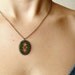 Cross stitch necklace Ukrainian ornament on dark green felt