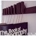 Custom made wooden book rack in Wenge. Movable pins.The pins also work as bookmarks.