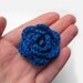 Blue crochet flower brooch