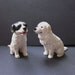 Two Pyrenean mountain dogs made to order, in one twelfth scale.