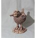 senseless bird with buck teeth and goofy face - Original ceramic sculpture - titled "Cuckoo"