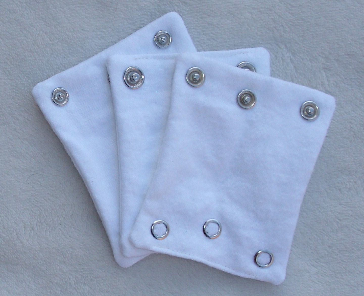 ONESIE EXTENDERS.  Add a size to your bodysuits. Also great for cloth diaper wearers.