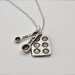 The Baker's Necklace - Measuring Spoons and Baking Pan