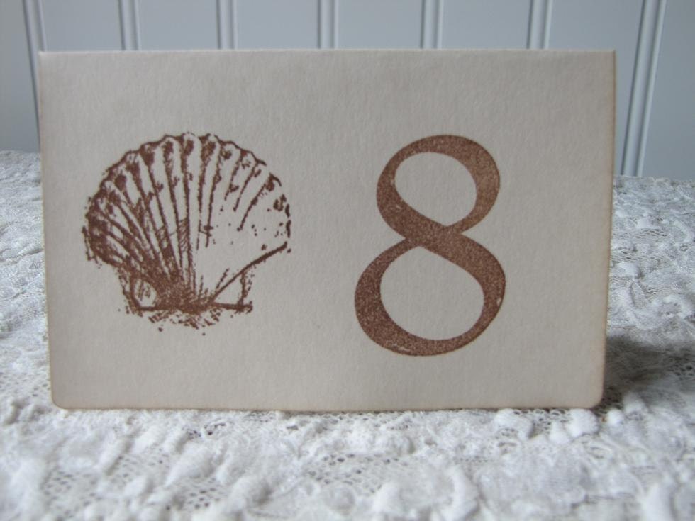 If you want unique hand made table numbers for your wedding this scallop 