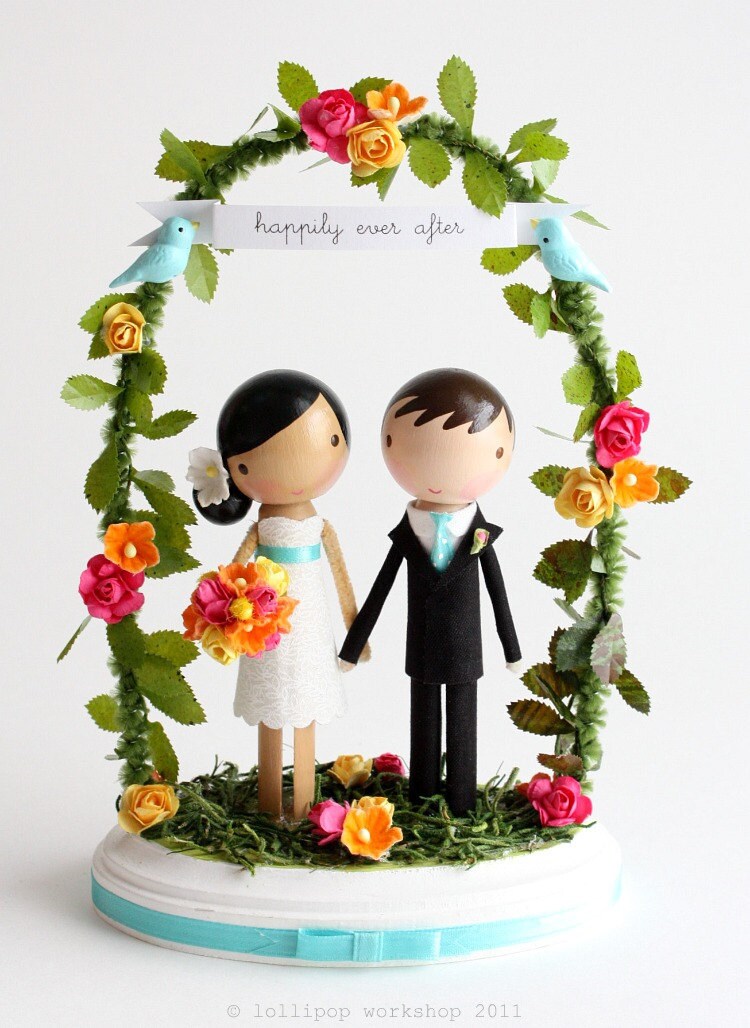 custom wedding cake topper with arch From lollipopworkshop