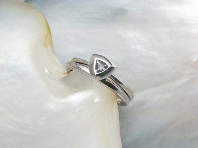 palladium wedding band and engagement ring set with triangle denim sapphire