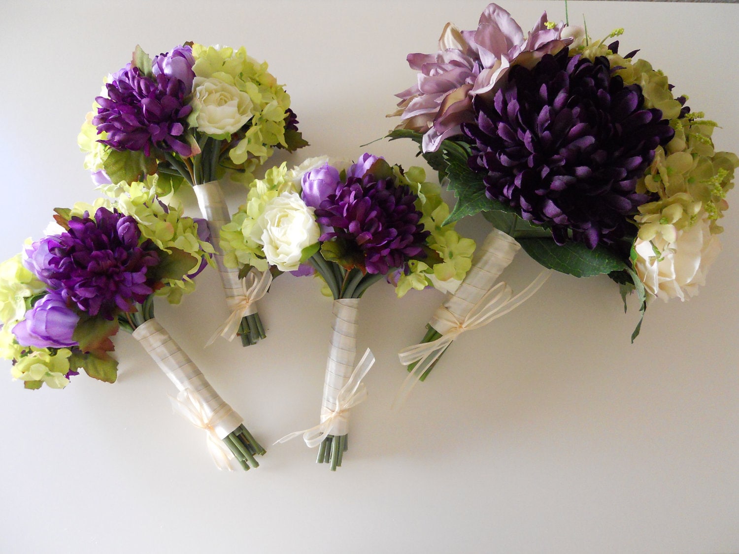 green and purple winter wedding bouquets